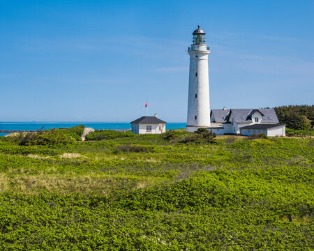 Low angle view of lighthouse against blue sky