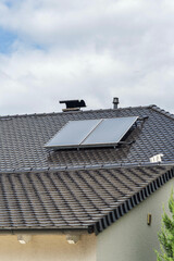 new building with solar panel on rooftop  with cloudy sky