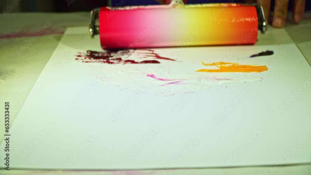 Poster .put the paint on the base for mixing the paint and use the roller to roll it back and forth .until 