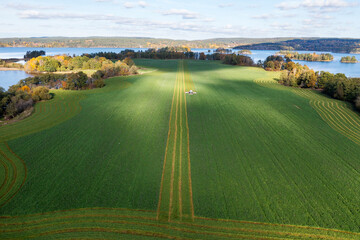 Aerial view of green field near lake
