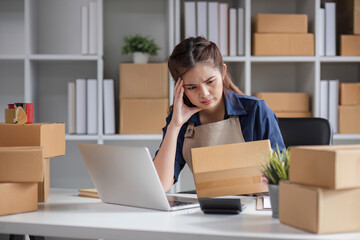 SME business entrepreneurs who conduct online sales businesses Sitting stressed while checking product management documents.