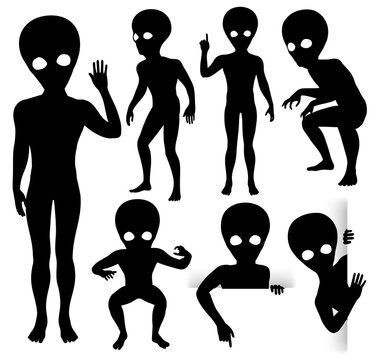Vector silhouettes of little grey aliens