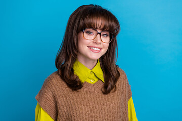 Portrait of smart cheerful satisfied cute girl with retro hairdo wear knit vest in glasses smiling...