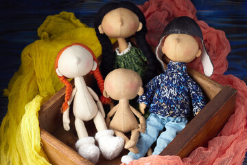 Fototapeta na wymiar Creating textile toys. Unfinished fabric dolls blanks without painting in box.