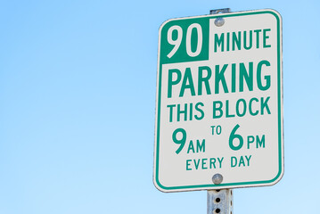 Close up of a parking sign along a street in a city centre. Copy space.