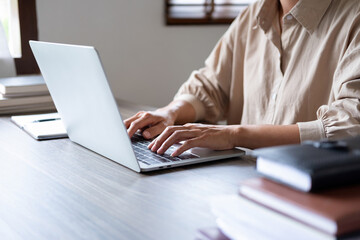 Businesswoman working on laptop.