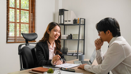 Businessmen working and discussing together.