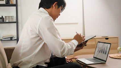 Businessmen working together using tablet.