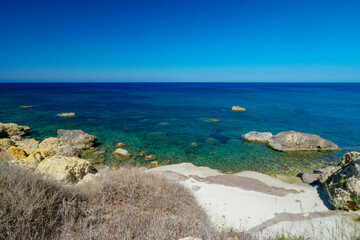 A hiking trail in the direction of Ramla Bay: .Ramla Bay is a sea bay with a sandy beach in the...