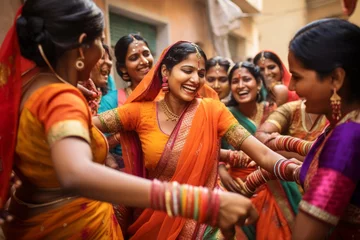 Photo sur Plexiglas Annapurna Beautiful Indian women wearing vivid colorful clothes singing and dancing during the Teej festival. Celebrating Hindu holidays.