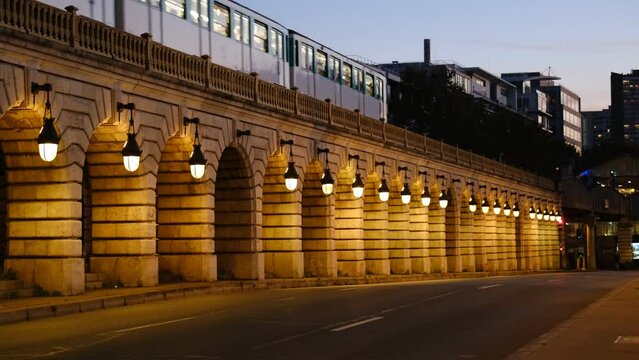 The Bercy bridge in the evening with a metro that runs on it. Paris, France - September 15th, 2023:  