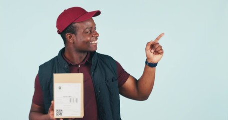 Courier man, boxes and point in studio with face, smile or mockup space for supply chain by blue background. African delivery guy, cardboard package or icon for choice, logistics or emoji for review