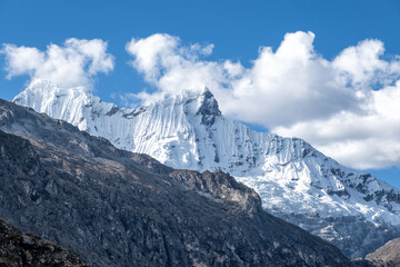 Large snow-capped mountain wall over 6500 meters above sea level - obrazy, fototapety, plakaty
