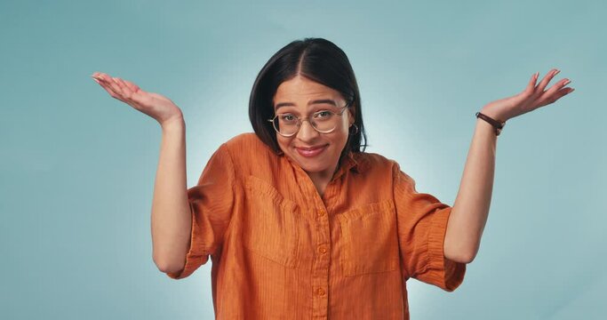 Confused, face and woman in studio with why hands for choice, dont know or asking on blue background. Doubt, portrait and lady model show palm scale solution, balance or questions, emoji or how to