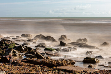 Looking out over the ocean at Pett Level Beach, with long exposure
