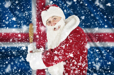 Santa Claus aggressively threatens with a bat against the backdrop of falling snow and the flag of Iceland