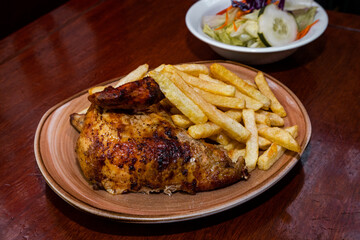 grilled chicken and potatos on a plate