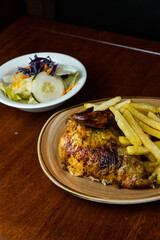 grilled chicken and potatos on a plate