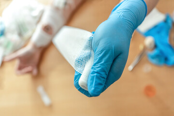 Wound care concept: Symbolizing change of dressing and cleaning and debridement of a wound with a...