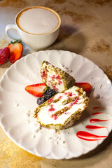 top view meringue roll cut on a white plate on the table
