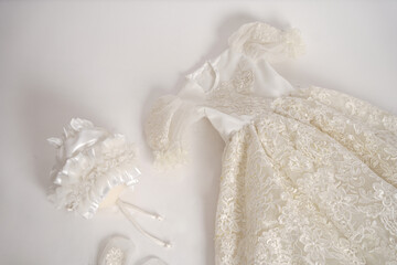Baby vintage victorian outfit. new baby born white dresss with shoes and head wear on a white background.          