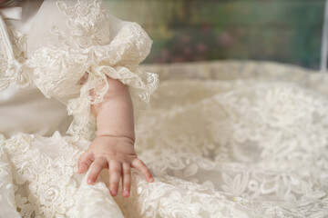 little baby girl photoshoot only hand wearing a cute white big dress.          