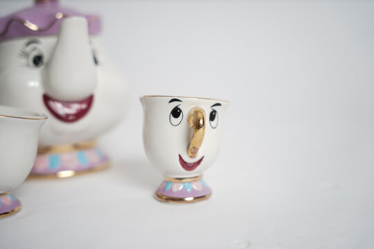 Beauty And The Beast Tea Set. Disney Theme Characters Tea Set On A White Background.               