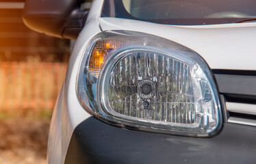 Front of white commercial car van. Half view of white car