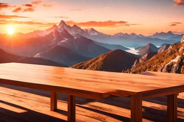 Foto op Canvas Brown blank wooden table top with the mountain landscape. table background of free space for your decoration and blurred landscape of mountains. orange sky sunset in the evening. © Areesha