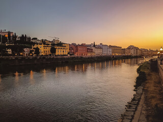 Bank of the River Arno at dusk with street lamp lights reflected in the water, Florence ITALY - obrazy, fototapety, plakaty