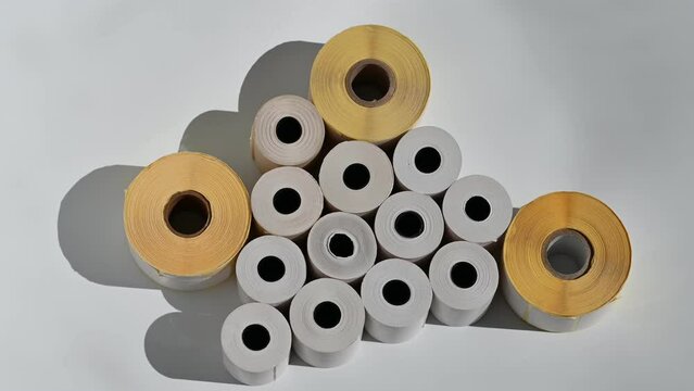 Rolls of white labels isolated. Labels for direct thermal or thermal transfer printing. Blank sticky label roll for thermal transfer printing pirce criss.	
