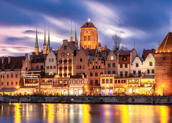 City embankment and facades of medieval houses in the old town at sunset, Gdansk. Poland.