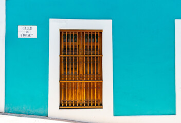 Puerto rico wooden front door house background with turquoise paint on wall from san juan 