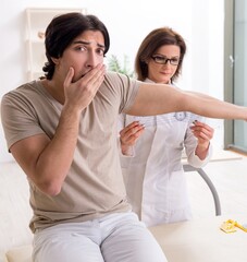 Female doctor checking patient's joint flexibility with goniomet