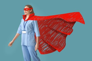 Female doctor in superhero costume on blue background