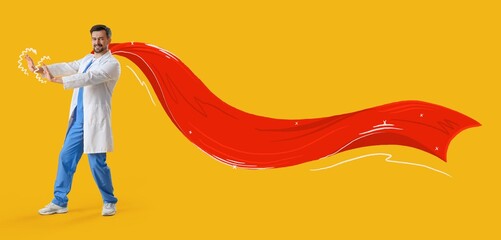 Male doctor in superhero costume on yellow background