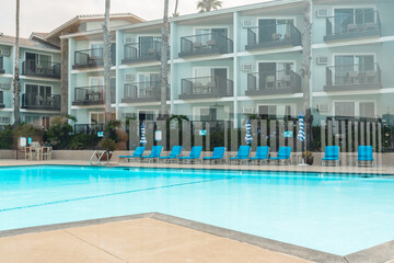 A tranquil morning scene at a hotel, with an empty pool