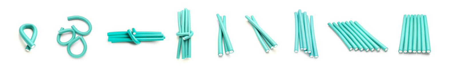 Set of hair curlers on white background