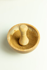 Wooden kitchen mortar on white background