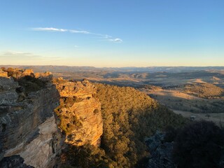 Sunset over the blue mountains, Sydney, Australia, NSW. Spectacular panoramic view from a lookout. Dry bushes. Sunrise over a grand canyon.