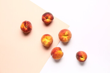 Sweet peaches on colorful background