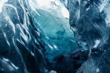 Foto auf Acrylglas Massive ice chucks inside crevasse used for glacier hiking, vatnajokull ice mass in scandinavian region. Impressive icy blocks inside caves and tunnels, global warming concept. © DC Studio