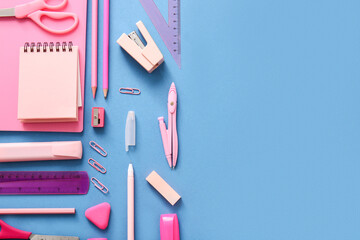 Different school stationery and notebooks on colorful background