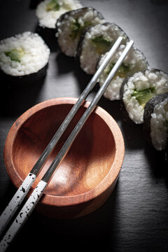 Artisanal Plant-Based Sushi on Wooden Tray with Eco-Friendly Chopsticks