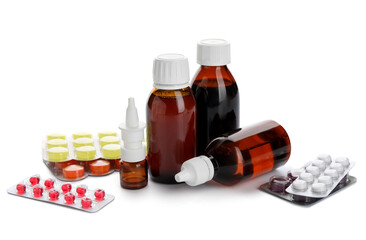 Different pills and bottles of medicines on white background