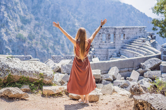 Woman tourist explores Stunning Ancient Theater of Termessos Ancient City turkiye, GO Everywhere