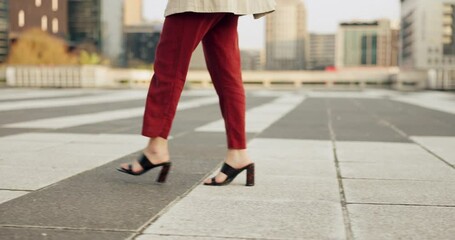 Business woman, shoes and walking on sidewalk in city, cbd and travel to urban office building in morning. Entrepreneur, commute and journey in high heels in town, street or road with person feet