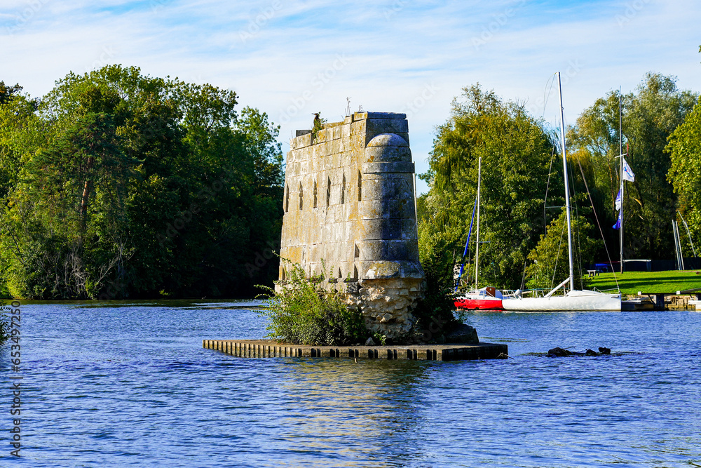 Sticker remains of a medieval bridge pier in the river seine in vernon, normandy, france