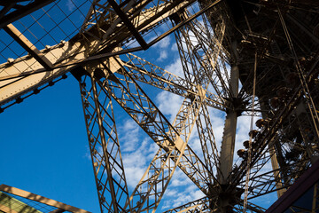 Closeup of metal girders and framing constructions of famous Eiffel Tower in Paris..