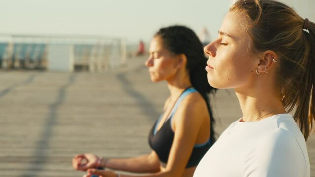 Women train physical and mental balance in lotus poses